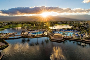 A resort with a large pool, palm trees, and a view of mountains. - JW Marriott Desert Springs Resort & Spa (Palm Desert)