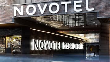 A hotel entrance with a prominent "NOVOTEL" sign.