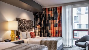 A hotel room with two beds, a large window with curtains, a desk with a lamp, and a chair. - Hotel Eastlund, BW Premier Collection (Portland)