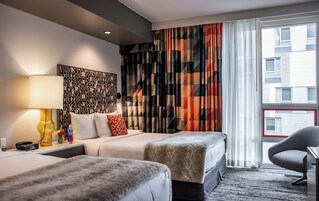 Premium bedding, down comforters, pillowtop beds, minibar