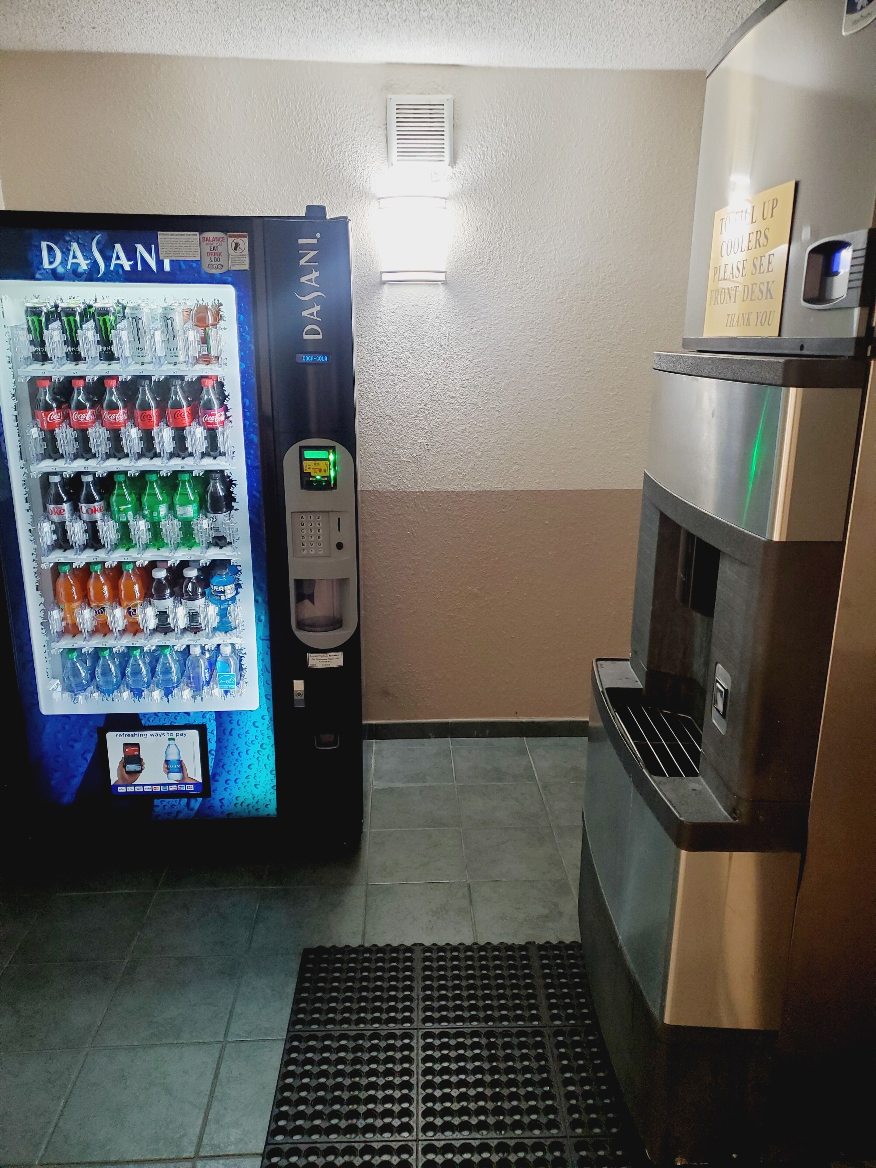 A vending machine with a variety of drinks and a coffee machine.