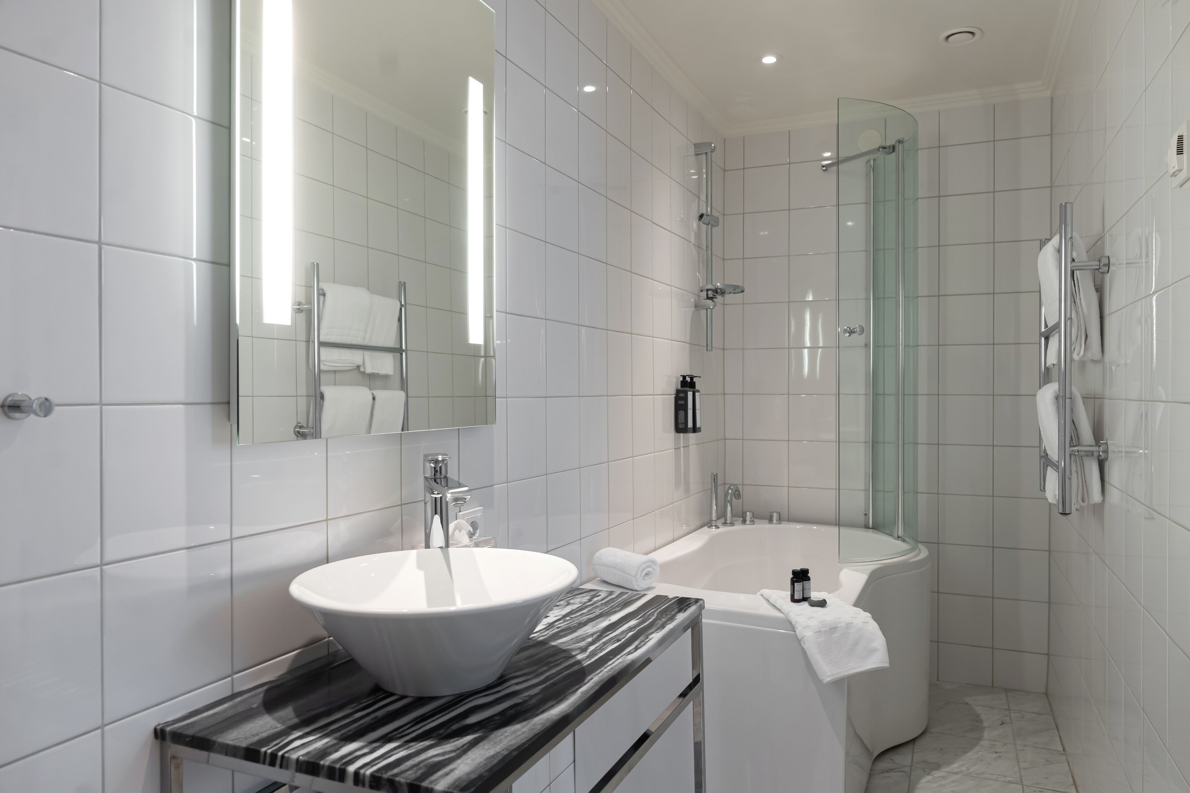 deluxe double room | bathroom | hair dryer, towels