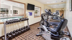 A gym with treadmills, stationary bikes, and dumbbells. - Quality Inn Lincoln Cornhusker (Lincoln)
