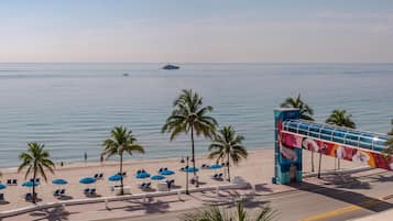 On the beach, sun loungers, beach umbrellas, beach towels