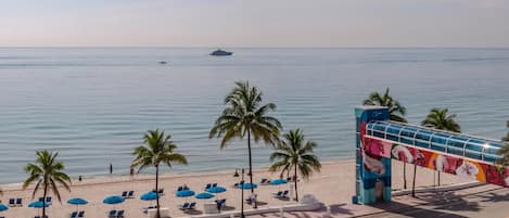 On the beach, sun-loungers, beach umbrellas, beach towels