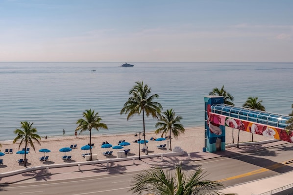 On the beach, sun loungers, beach umbrellas, beach towels