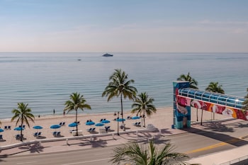 On the beach, sun loungers, beach umbrellas, beach towels at The Westin Fort Lauderdale Beach Resort