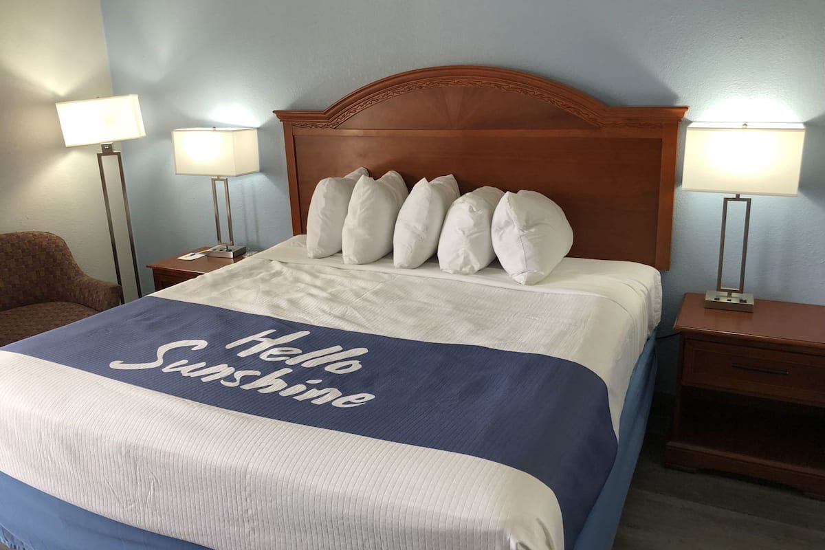 Premium bedding, desk, laptop workspace, iron/ironing board
