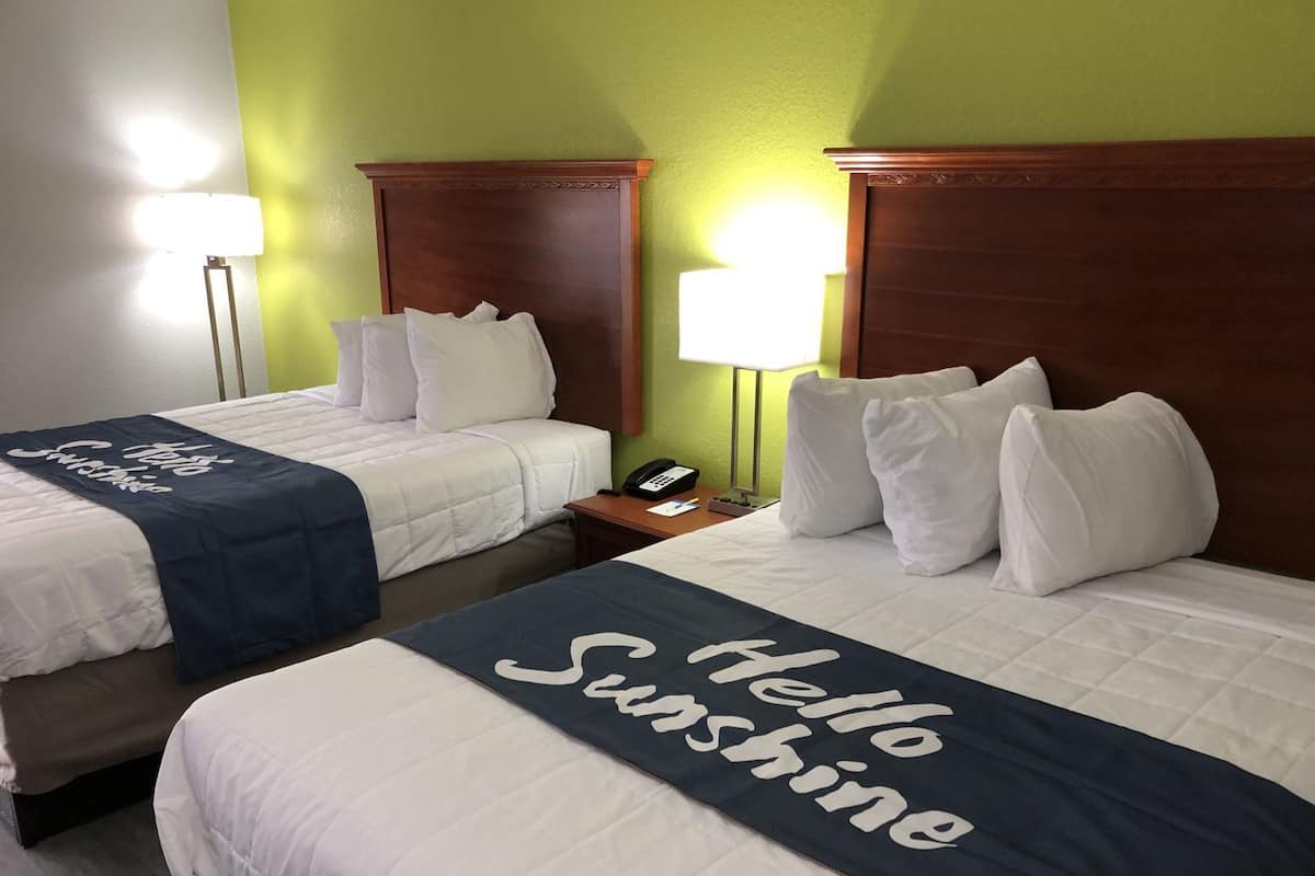 Premium bedding, desk, laptop workspace, iron/ironing board