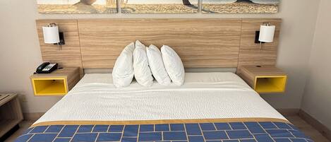 Premium bedding, desk, laptop workspace, iron/ironing board