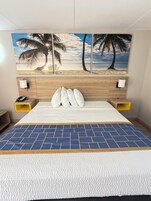 Premium bedding, desk, laptop workspace, iron/ironing board