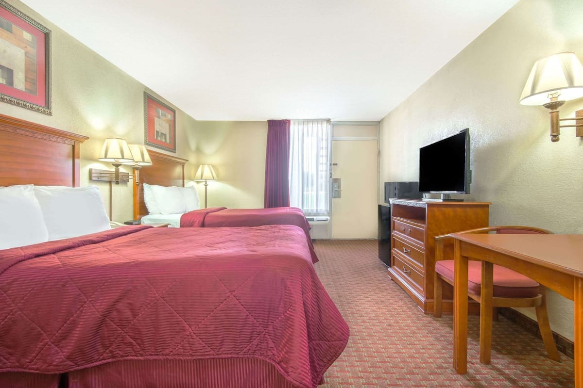 Premium bedding, desk, laptop workspace, iron/ironing board