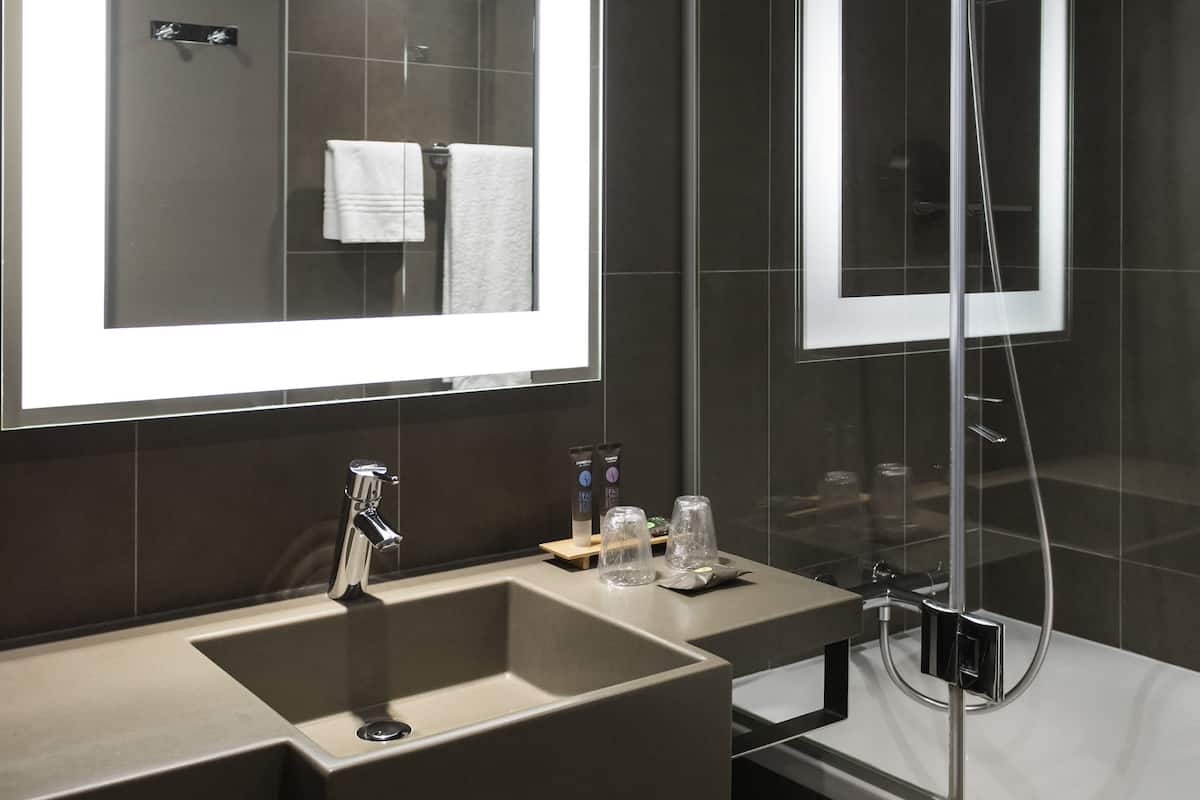 superior room, multiple beds (premium) | bathroom | separate bathtub and shower, eco-friendly toiletries, hair dryer, towels