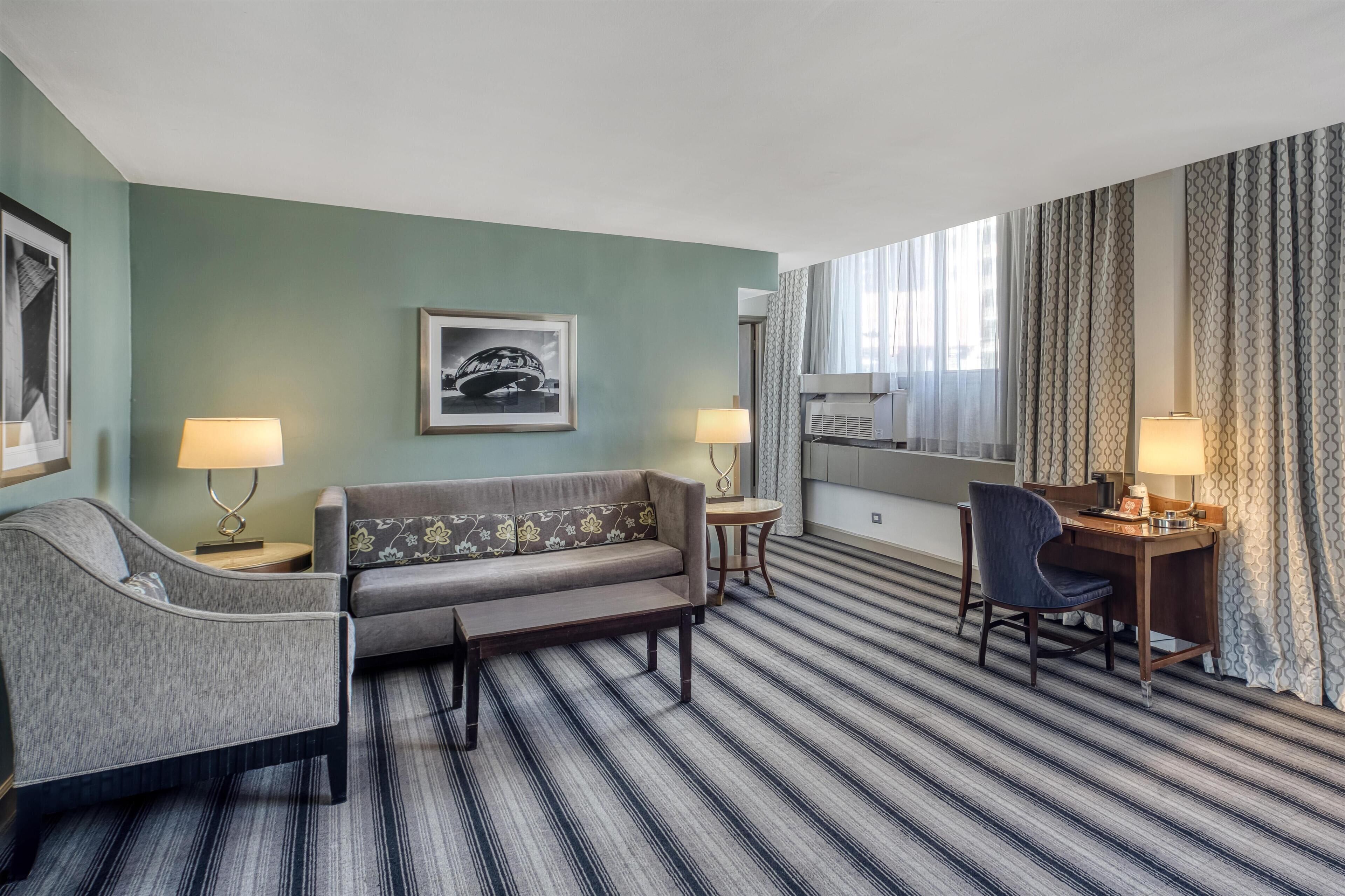 Premium Suite, 1 King Bed, Non Smoking, Refrigerator (with Sofabed) | Pillowtop beds, in-room safe, desk, laptop workspace