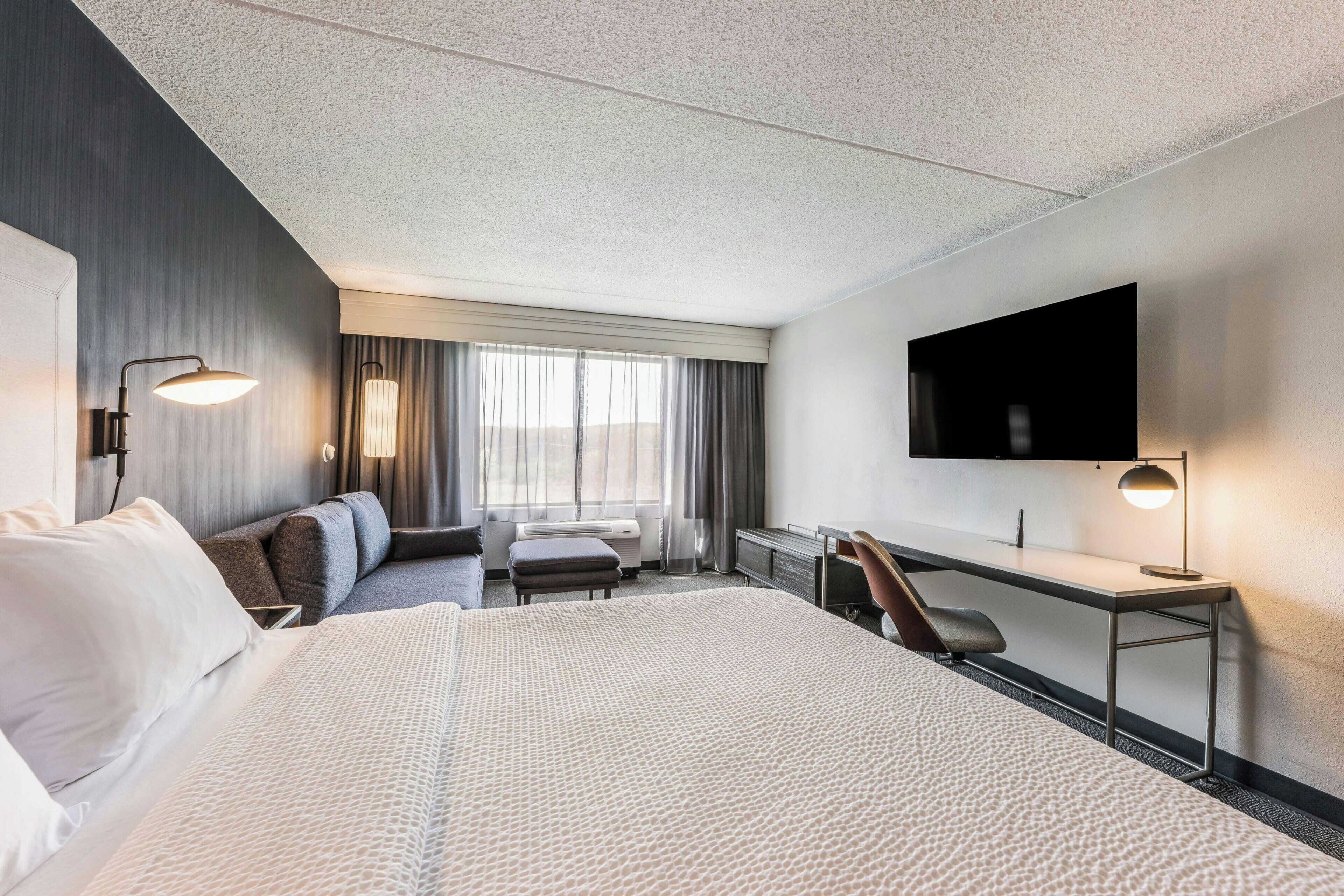 room, 1 king bed with sofa bed | premium bedding, desk, blackout curtains, iron/ironing board