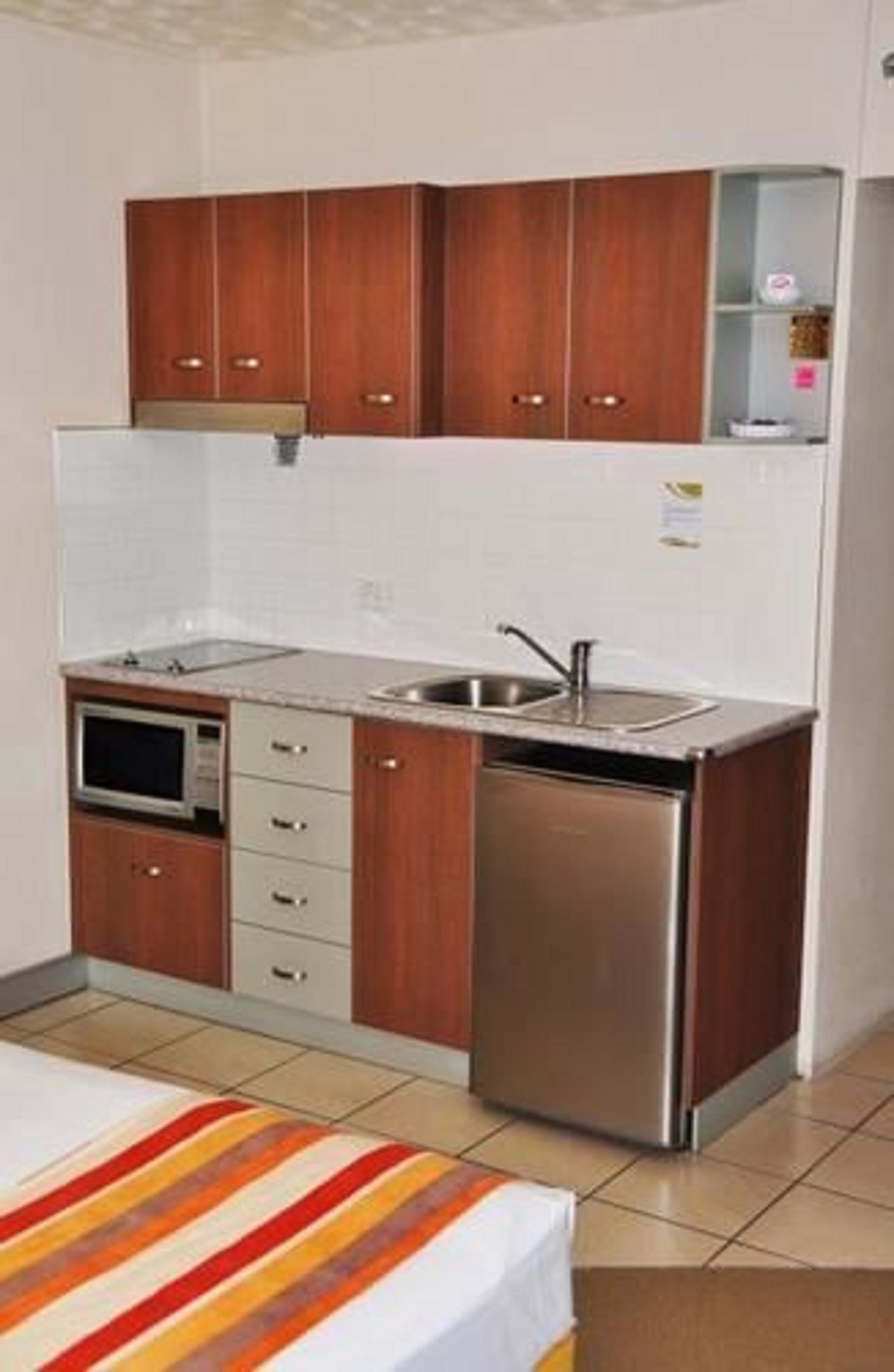 fridge, microwave, stovetop, electric kettle