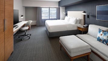 Premium bedding, desk, laptop workspace, iron/ironing board