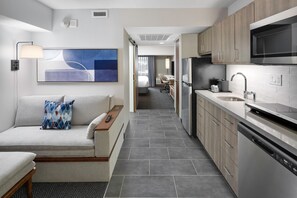 Premium bedding, desk, laptop workspace, iron/ironing board