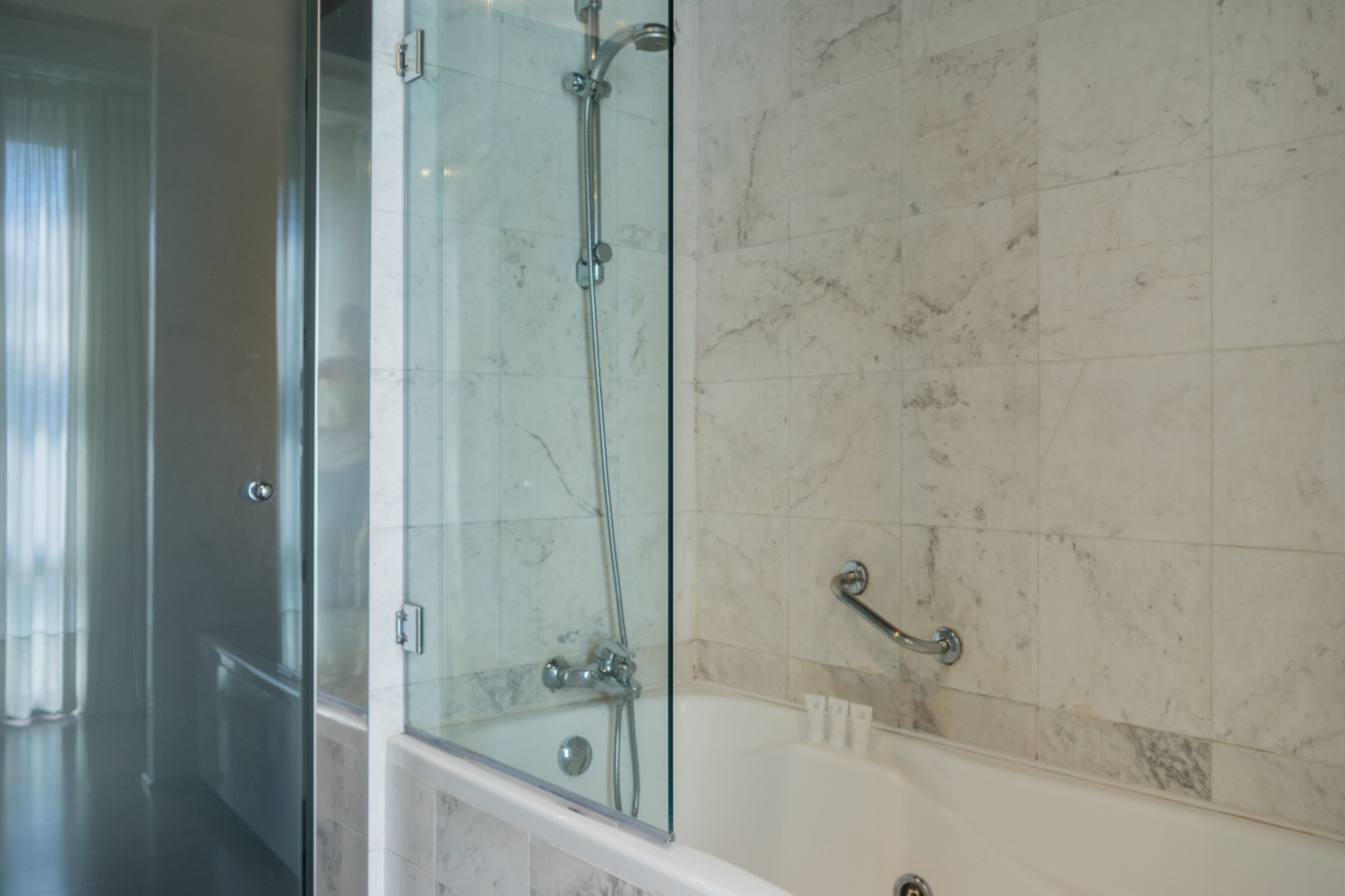 junior suite, 1 king bed, non smoking | bathroom | designer toiletries, hair dryer, towels