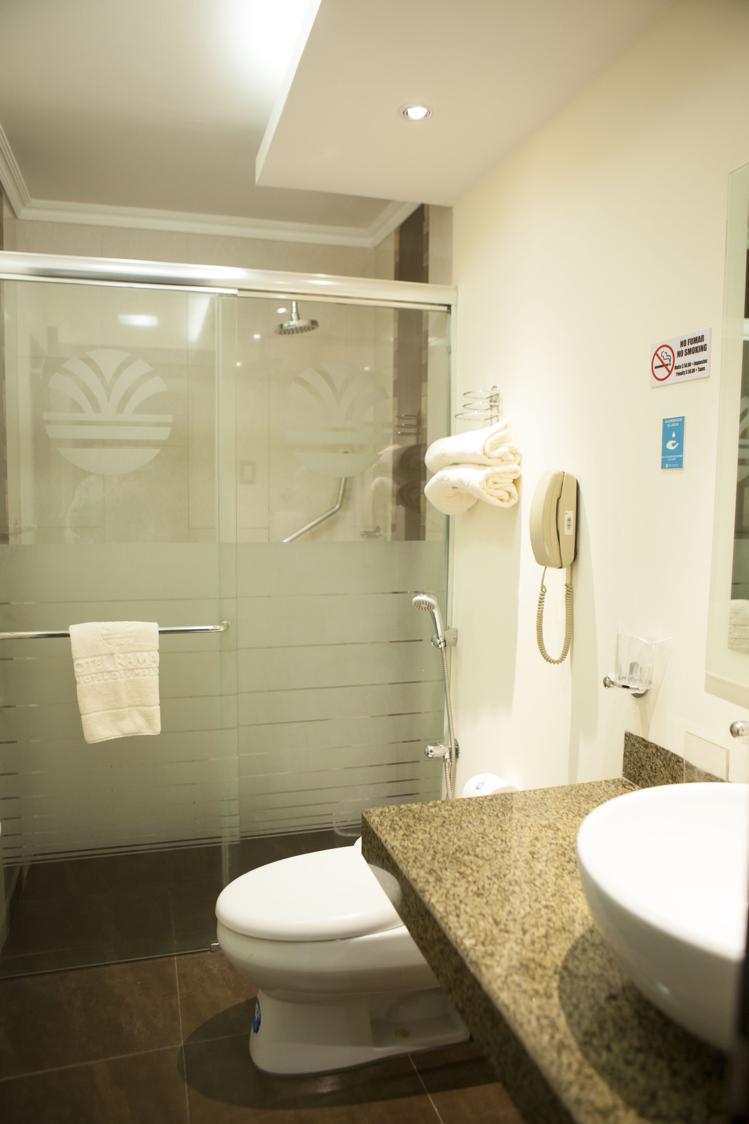 superior single room | bathroom | rainfall showerhead, hair dryer, towels