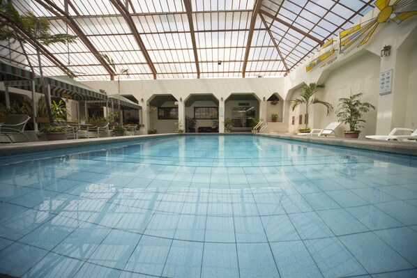 Indoor pool, open 8:00 AM to 10 PM, pool loungers