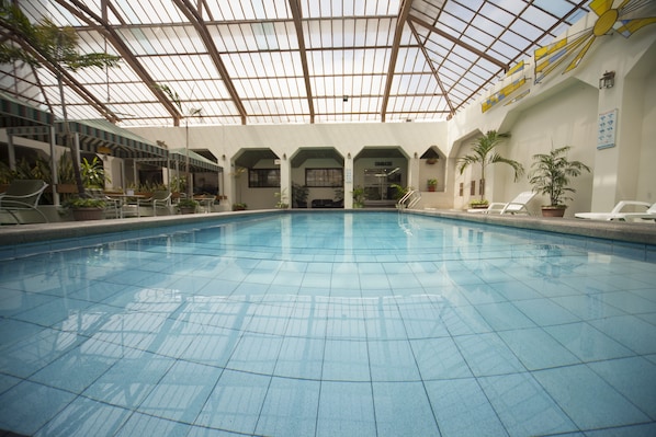 Indoor pool, open 8:00 AM to 10 PM, pool loungers