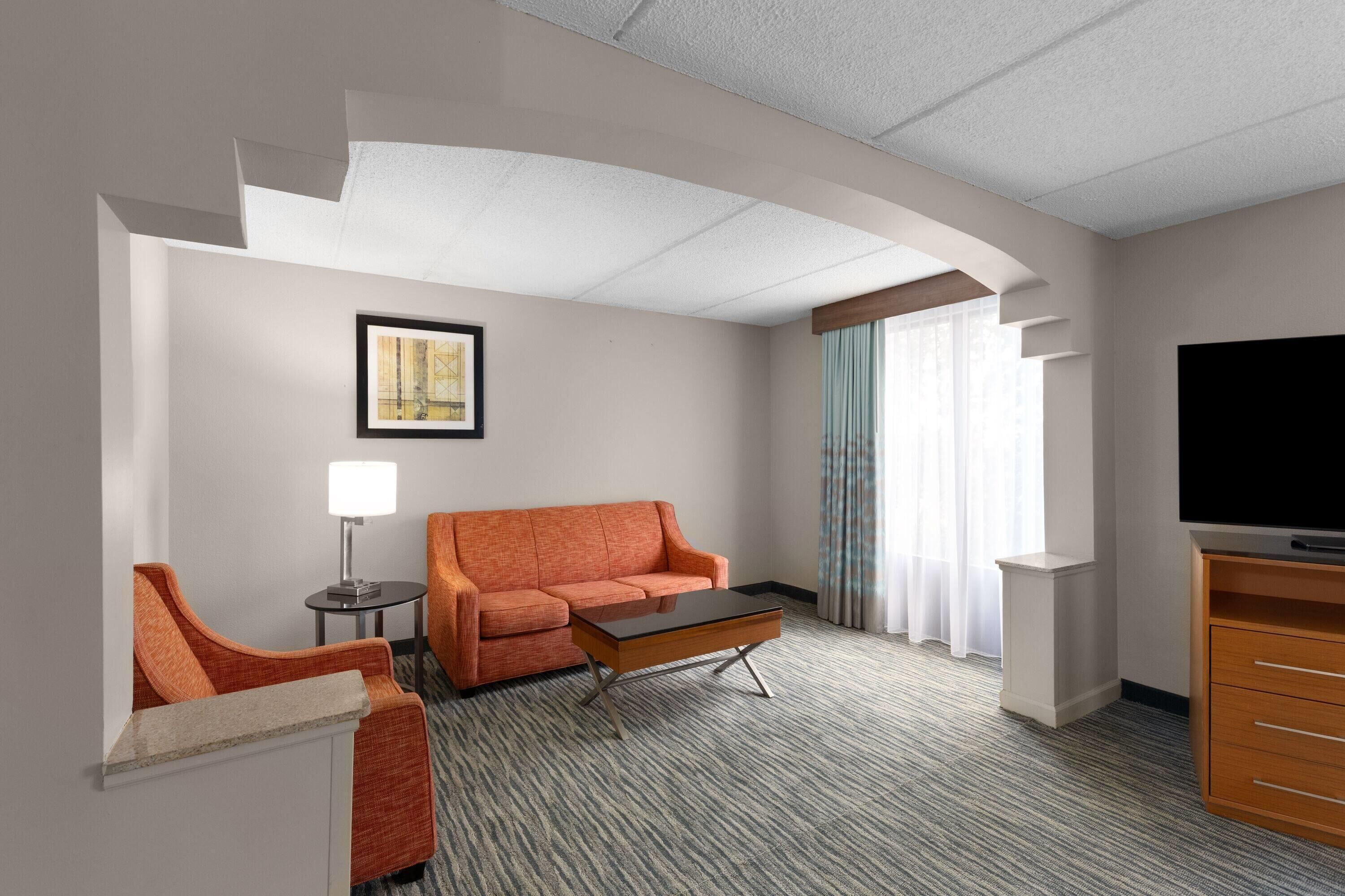 superior suite, 1 king bed, non smoking | desk, laptop workspace, blackout curtains, iron/ironing board