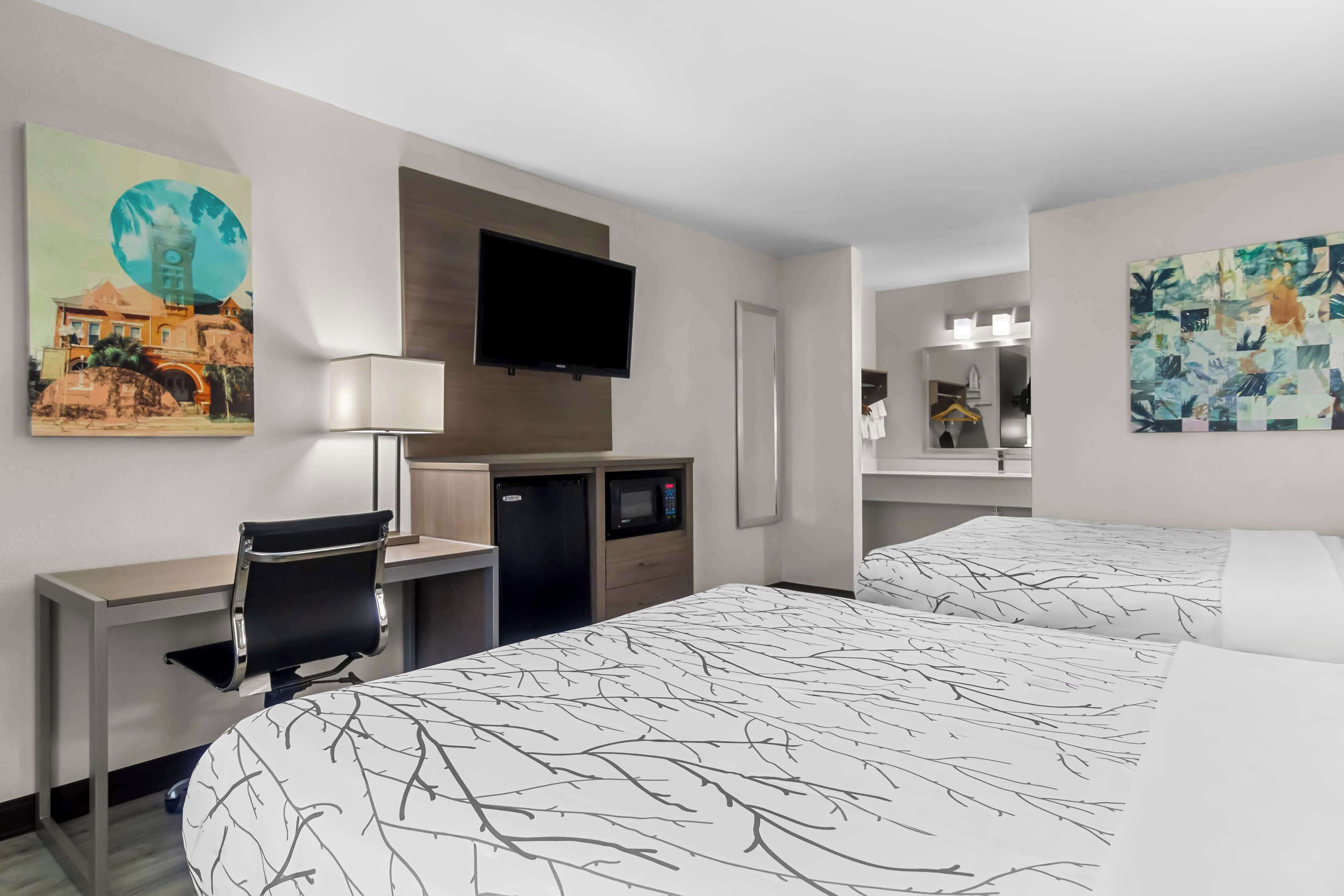 standard room, 2 queen beds, non smoking, refrigerator & microwave (shower only) | desk, laptop workspace, iron/ironing board, free wifi