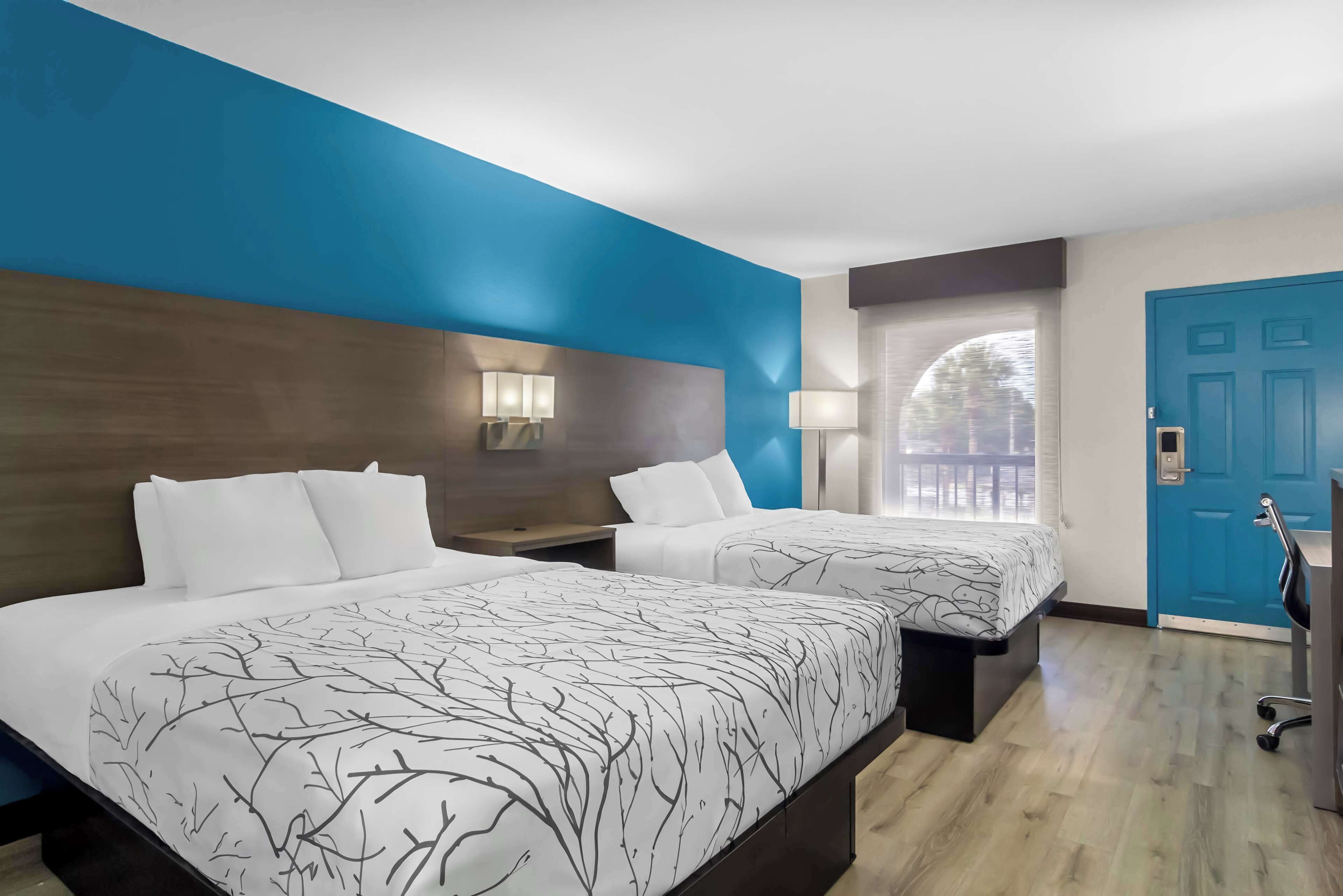 standard room, 2 queen beds, non smoking, refrigerator & microwave (shower only) | desk, laptop workspace, iron/ironing board, free wifi