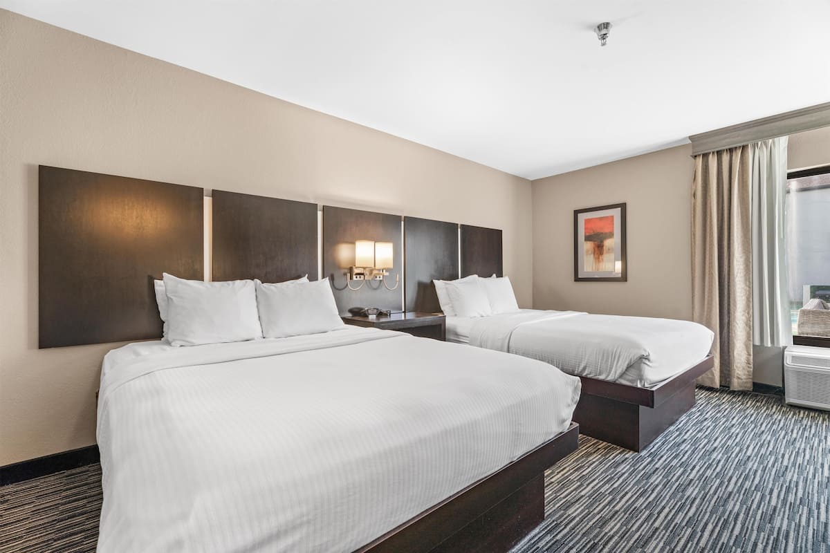 Premium bedding, desk, laptop workspace, blackout drapes