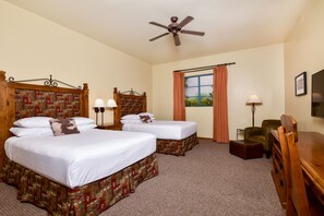 Two single beds with matching headboards and footboards, adorned with patterned runners, are set against a neutral backdrop.
