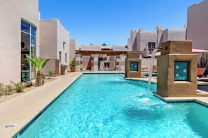 Outdoor pool, a heated pool, open 7:00 AM to 10:00 PM, pool umbrellas