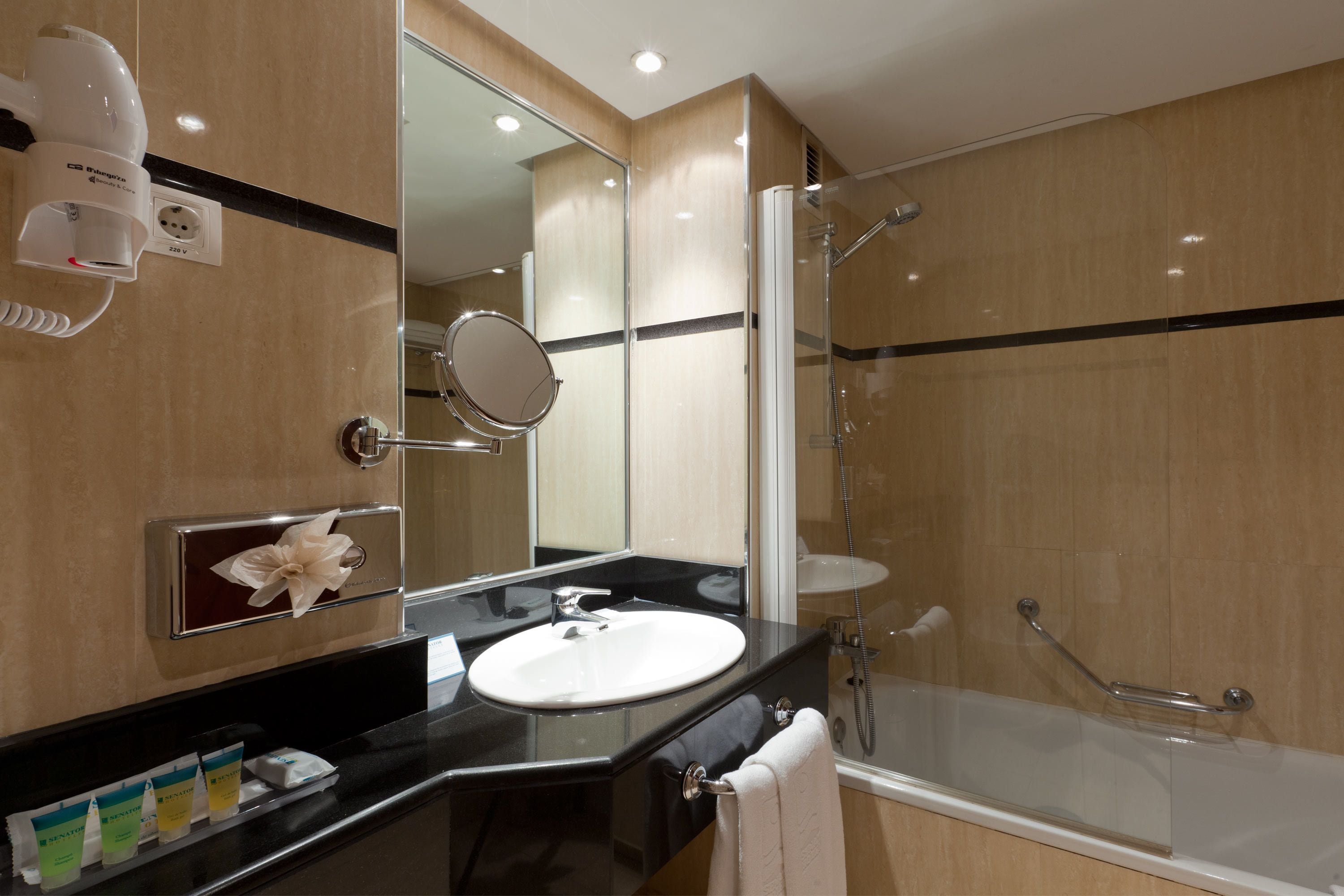 designer toiletries, hair dryer, towels, soap