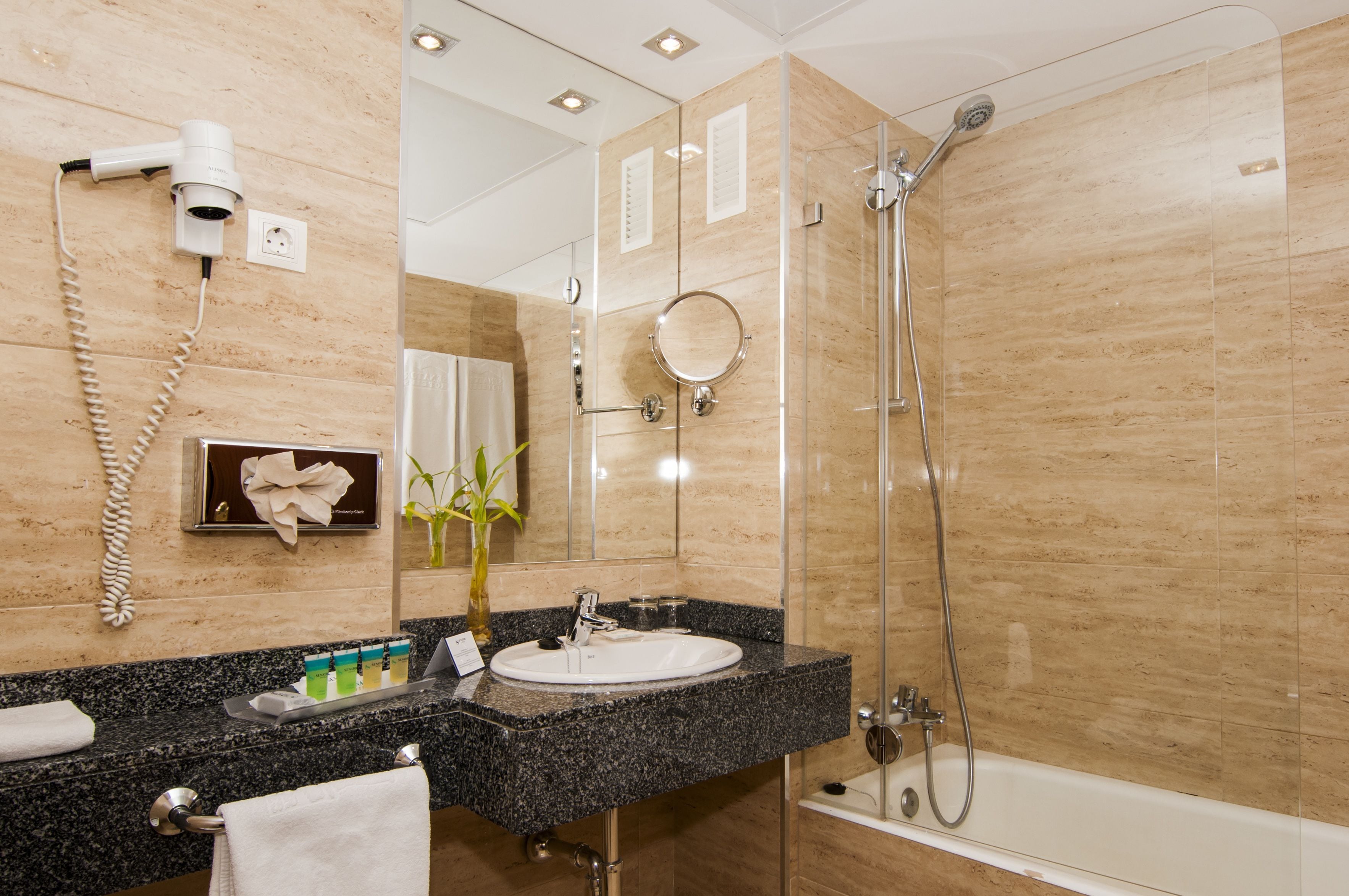 designer toiletries, hair dryer, towels, soap