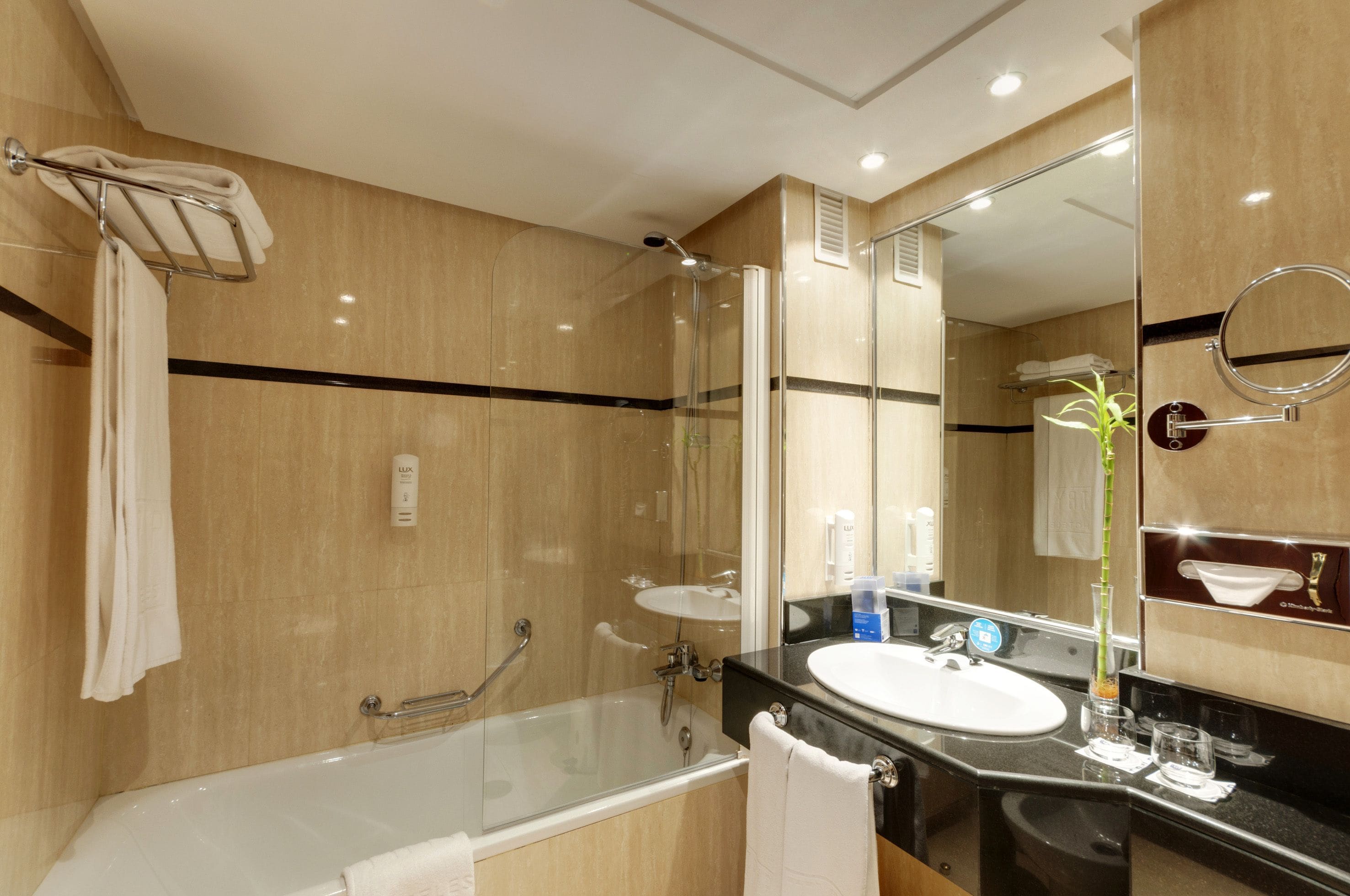 designer toiletries, hair dryer, towels, soap