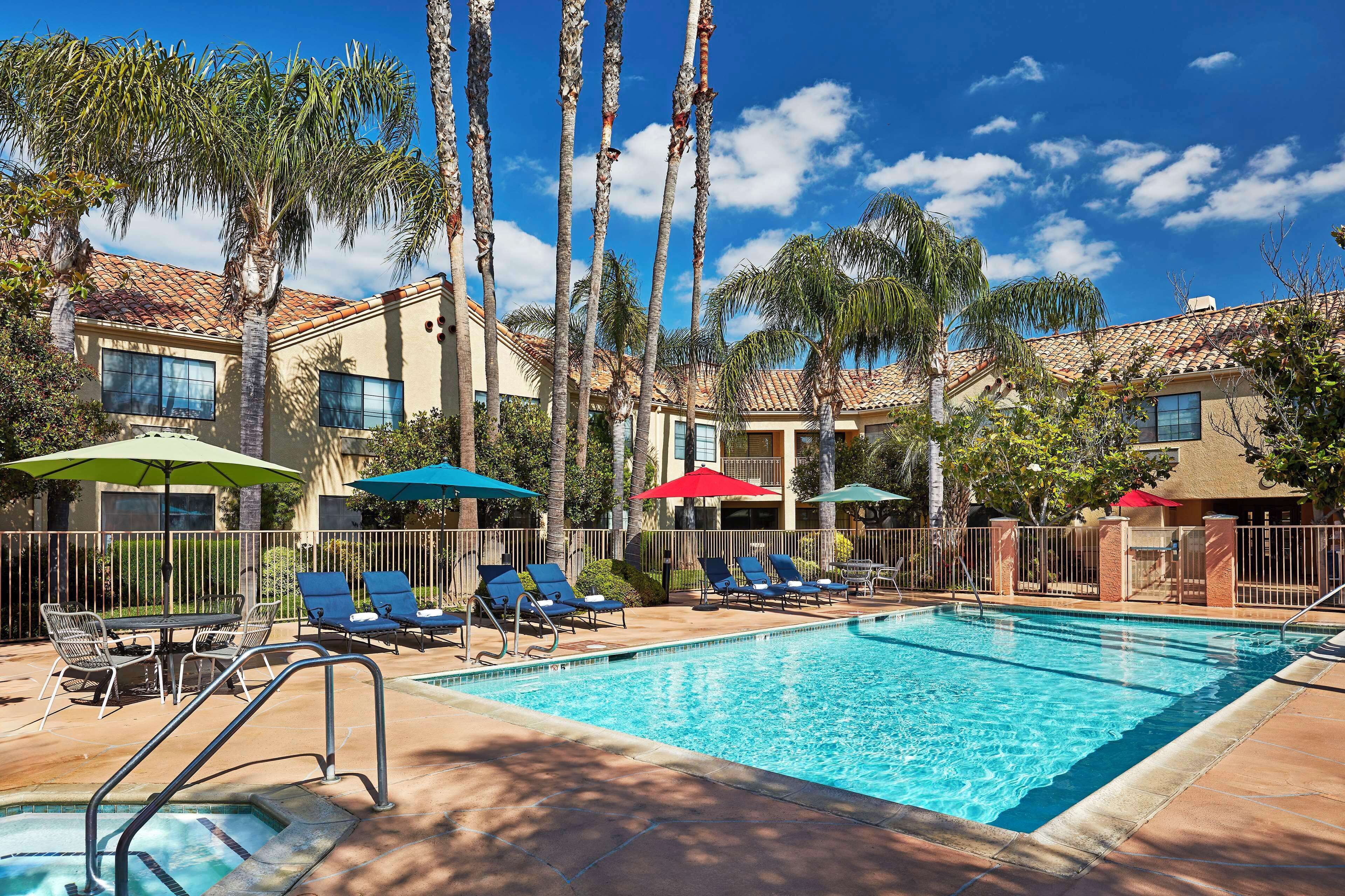 outdoor pool, open 8:00 am to 8:00 pm, pool umbrellas, pool loungers