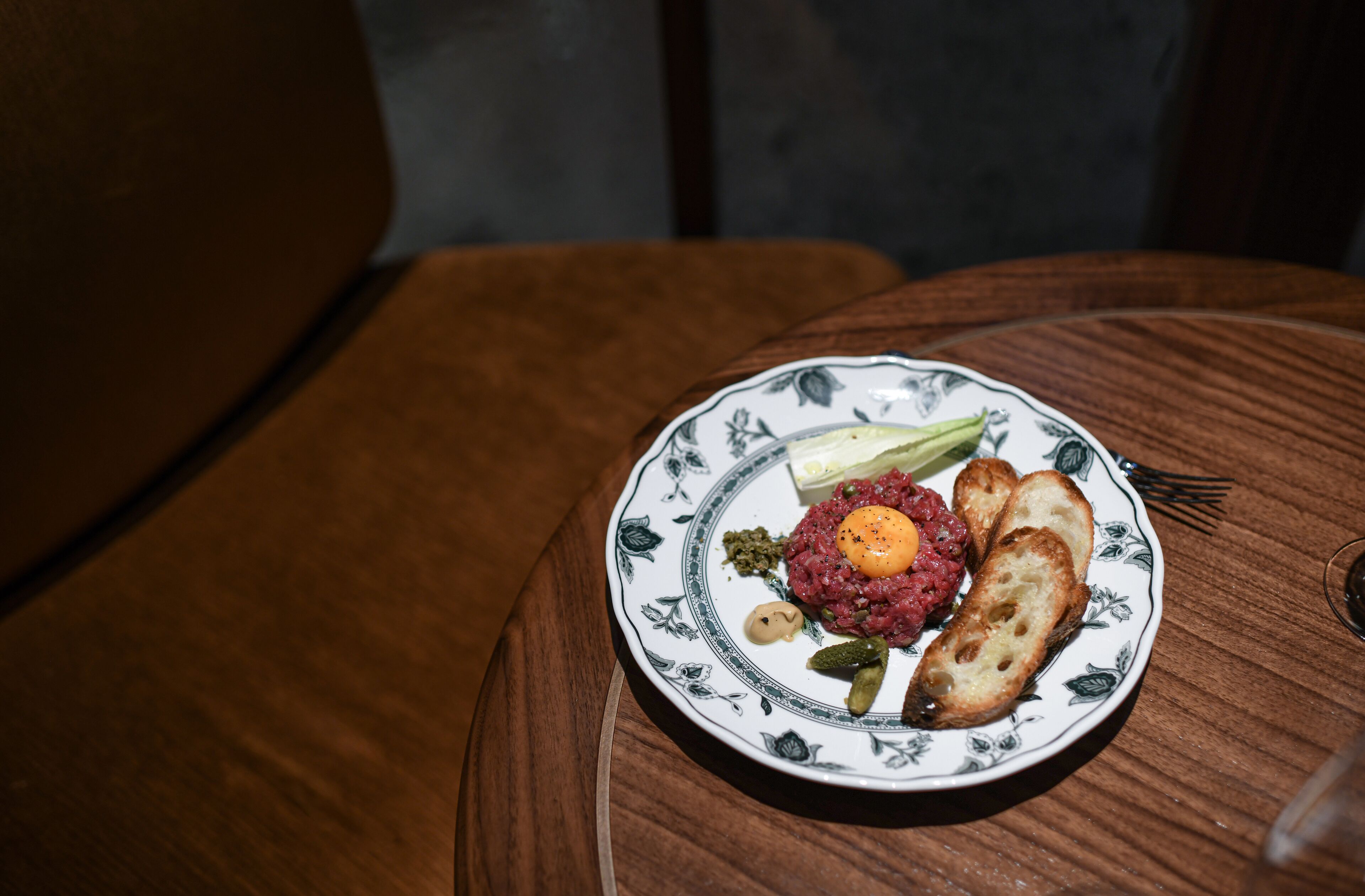 A plate of food on a wooden table.