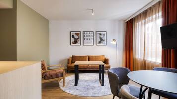 King Deluxe Family Room | Living area | Flat-screen TV