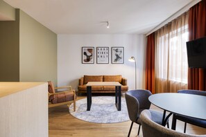 King Deluxe Family Room | Living area | Flat-screen TV