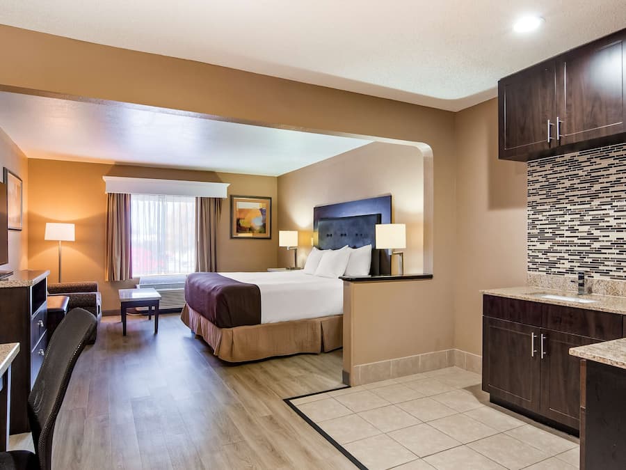 Desk, laptop workspace, blackout drapes, iron/ironing board