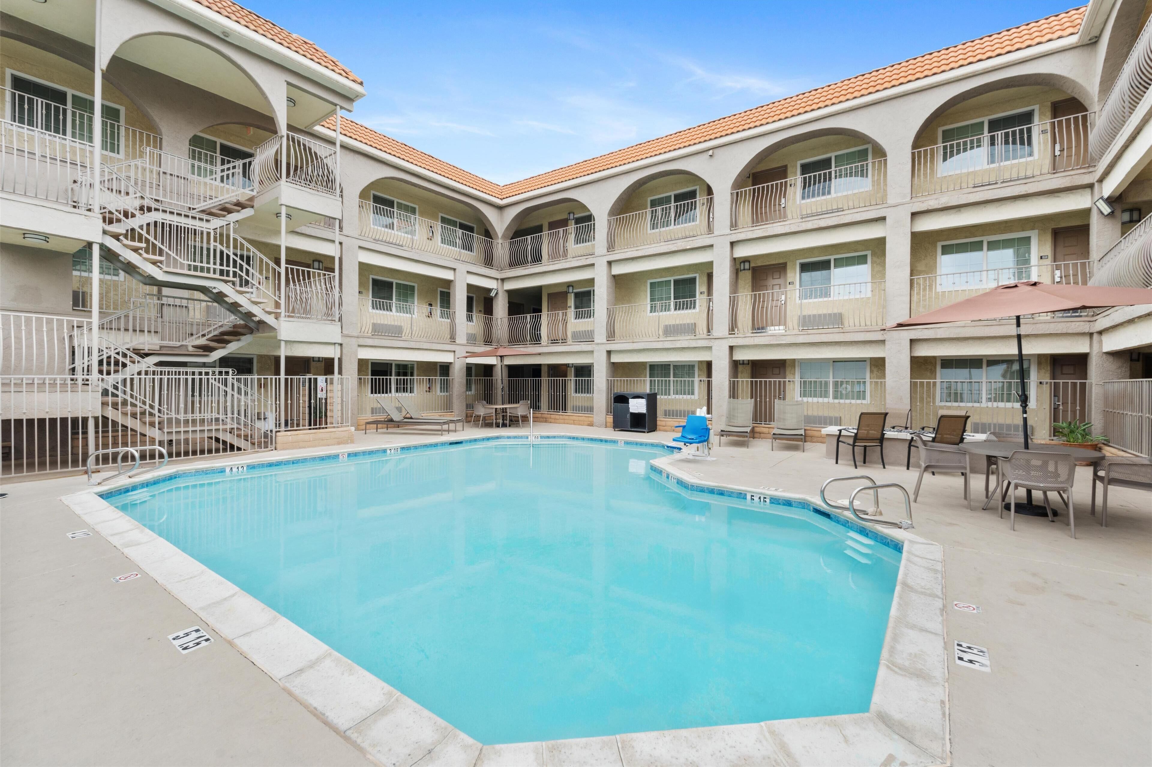 Outdoor pool, pool umbrellas, sun loungers