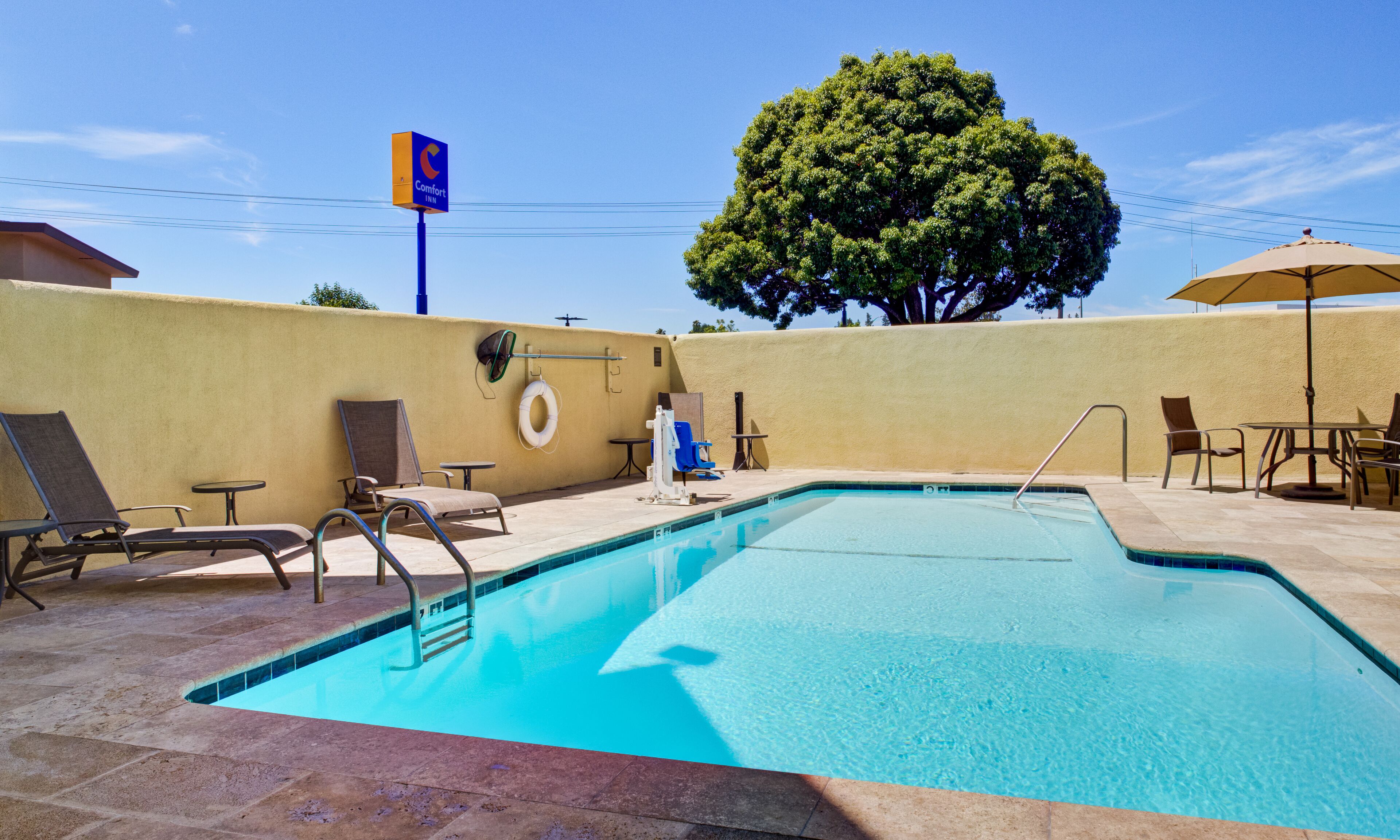 Outdoor pool, open 8:00 AM to 10:00 PM, pool loungers