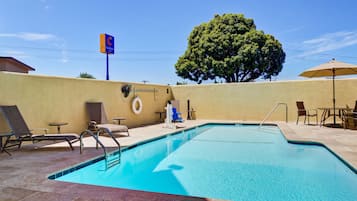 Outdoor pool, open 8:00 AM to 10:00 PM, pool loungers
