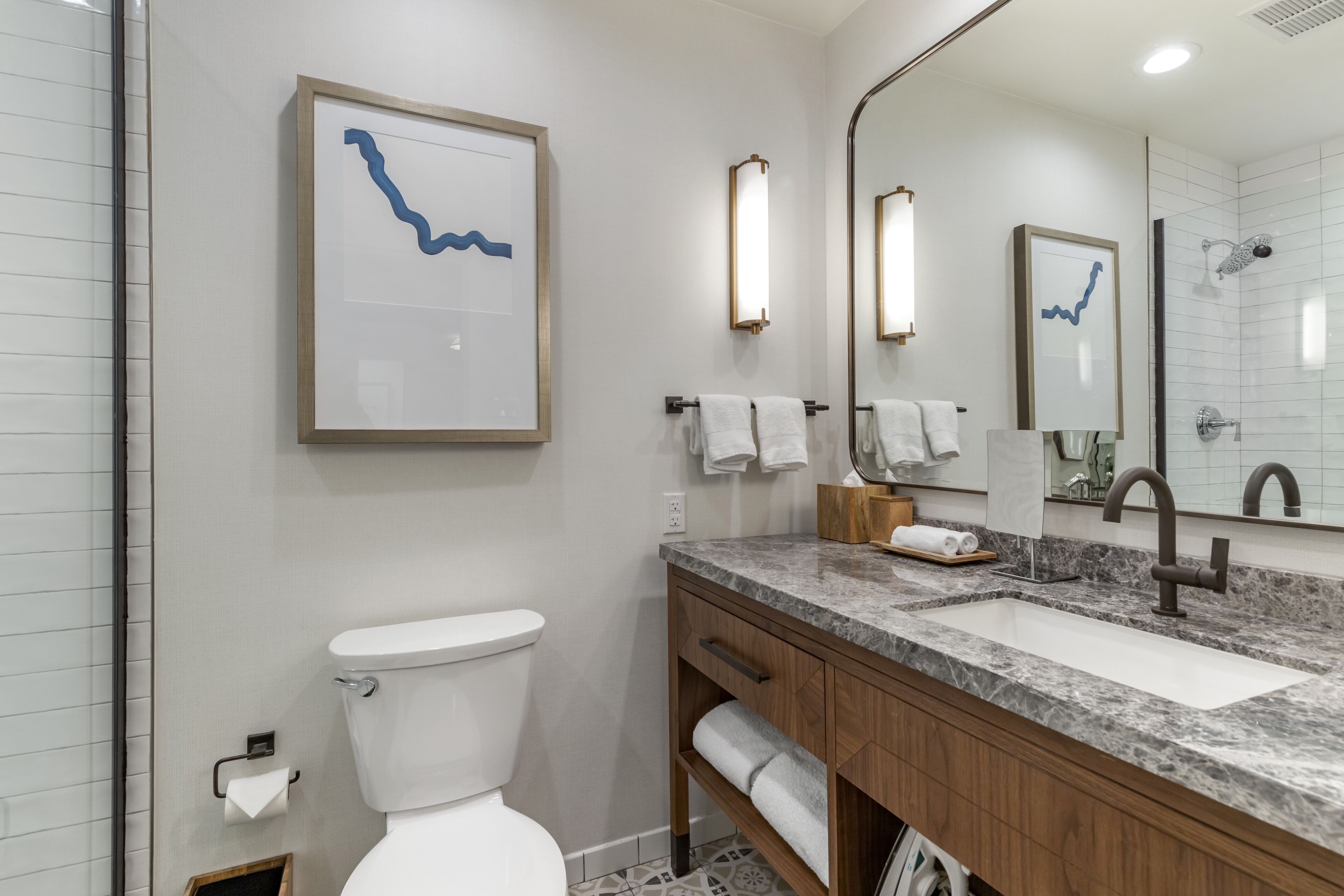 combined shower/bathtub, rainfall showerhead, designer toiletries