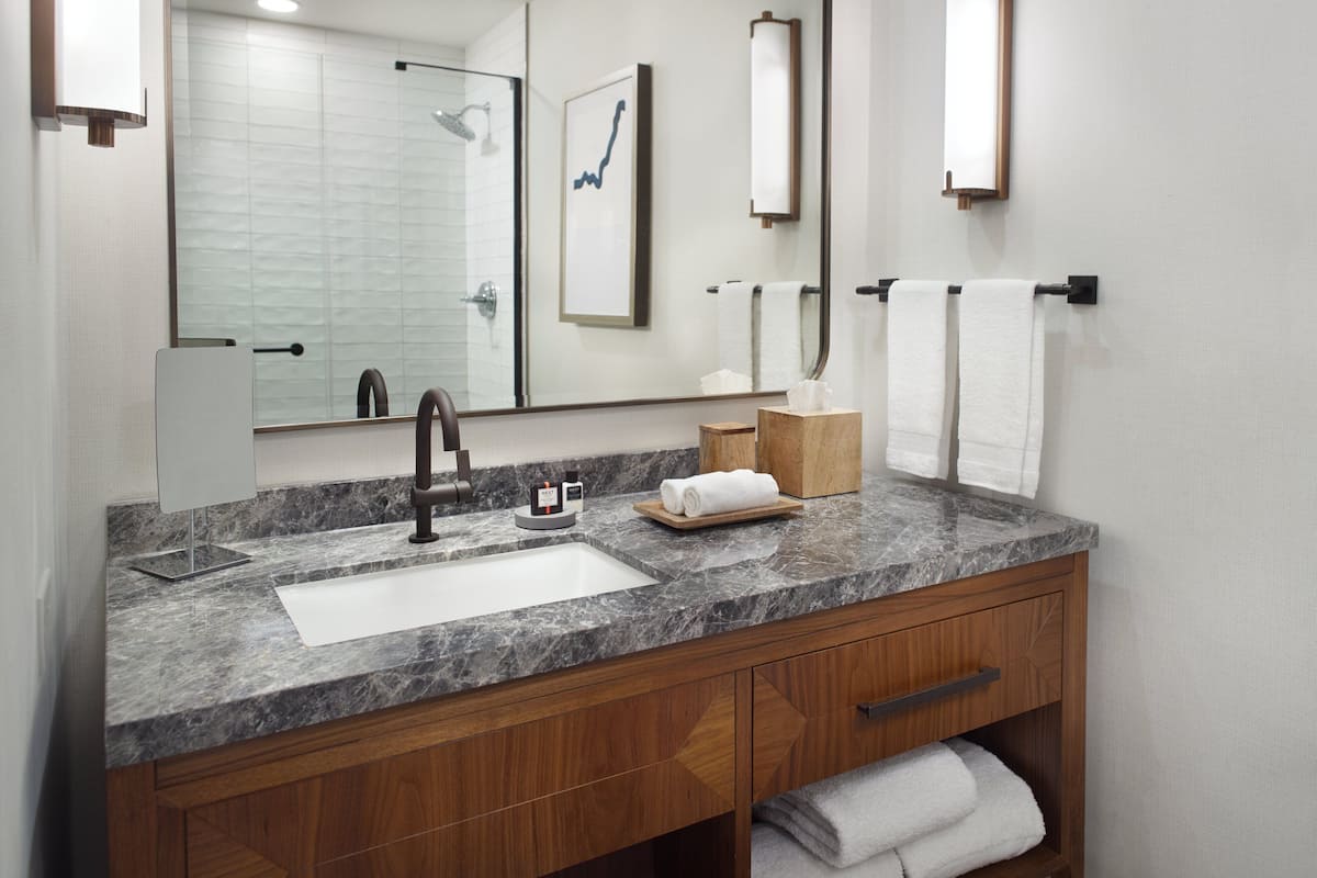 combined shower/bathtub, rainfall showerhead, designer toiletries