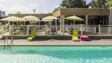 Seasonal outdoor pool, open 10:00 AM to 9:00 PM, pool loungers