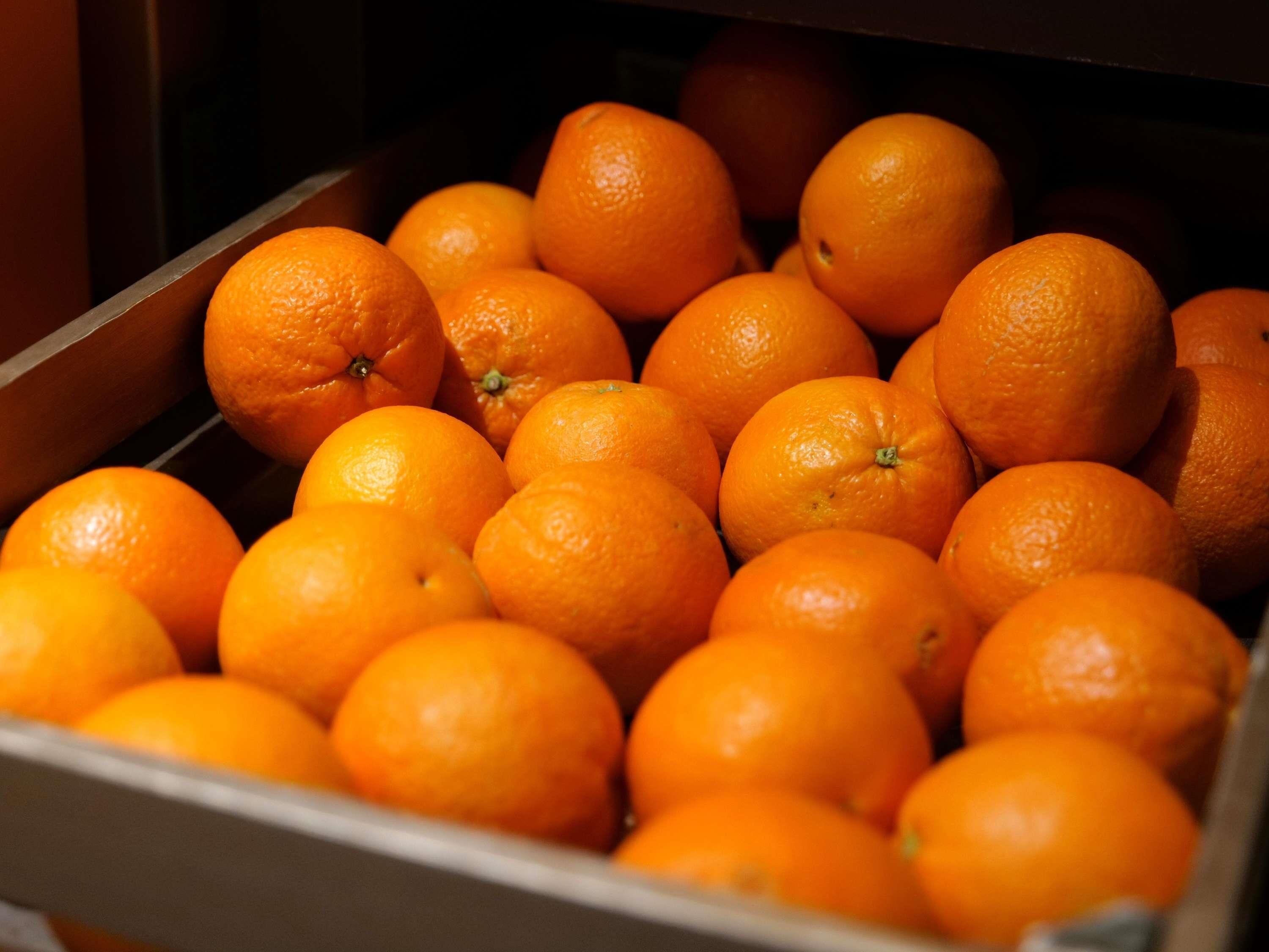 A box filled with oranges.
