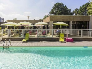 Seasonal outdoor pool, open 10:00 AM to 9:00 PM, pool loungers