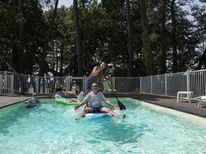 Seasonal outdoor pool, open 10:00 AM to 9:00 PM, pool loungers