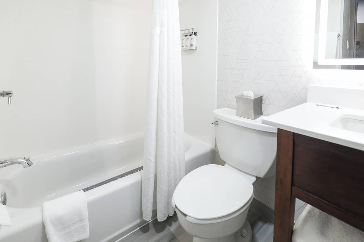 Desk, laptop workspace, blackout curtains, iron/ironing board